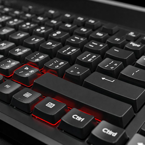 A computer keyboard with highlighted keys, suggesting the controls for playing GTA V on PC.